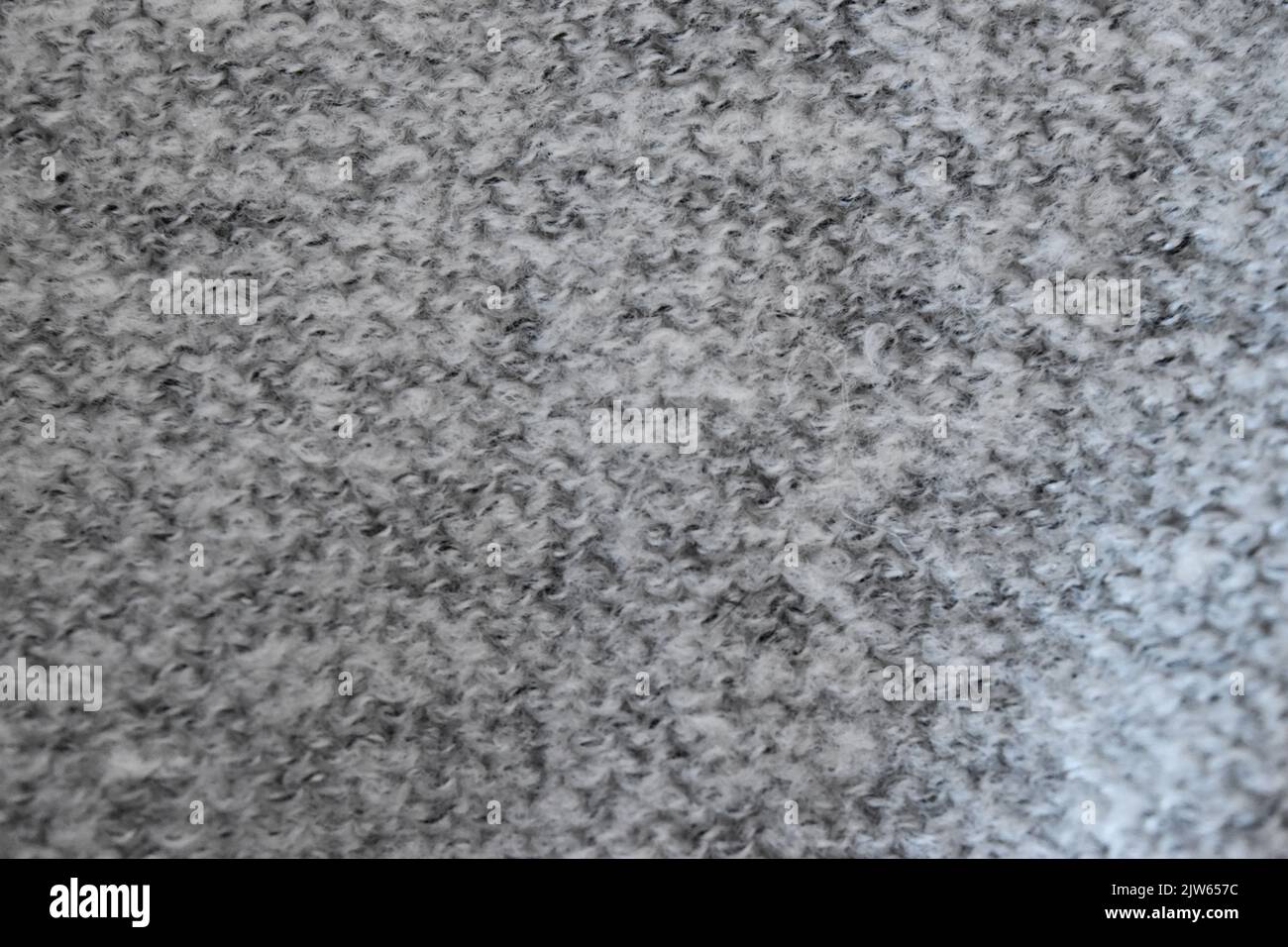 Grey wool knitted fabric texture close up background Stock Photo