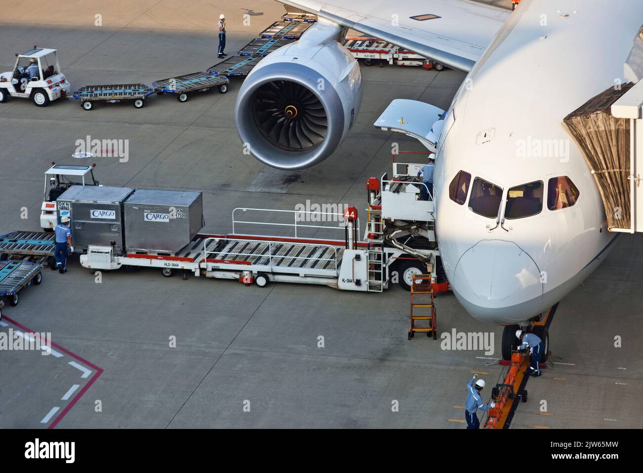 Plane serviced and loaded at gate at Haneda Airport, Tokyo, Japan Stock Photo