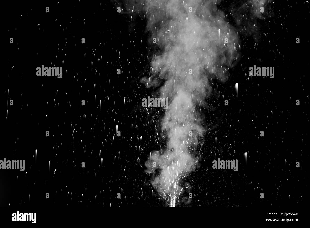 vapor steam rising over black background to overlay on your photos. Splashes and drops of water. Curly white steam rising up and splashing water scatt Stock Photo