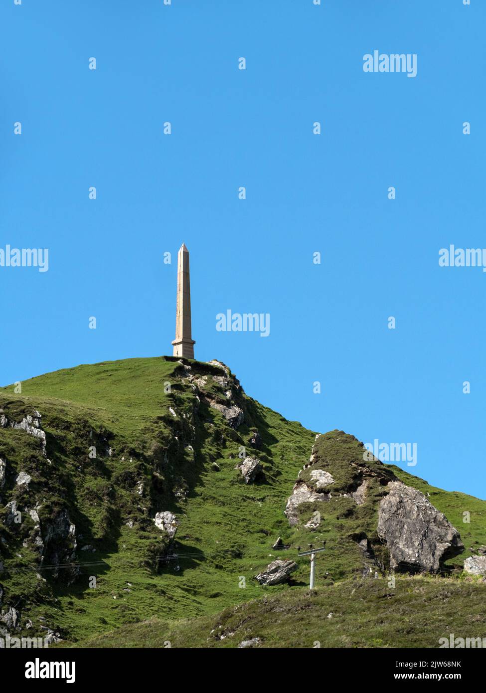 The Lord Colonsay Duncan MacNeill Monument obelisk stands in a prominent hilltop location on the remote Hebridean Island of Colonsay, Scotland, UK Stock Photo