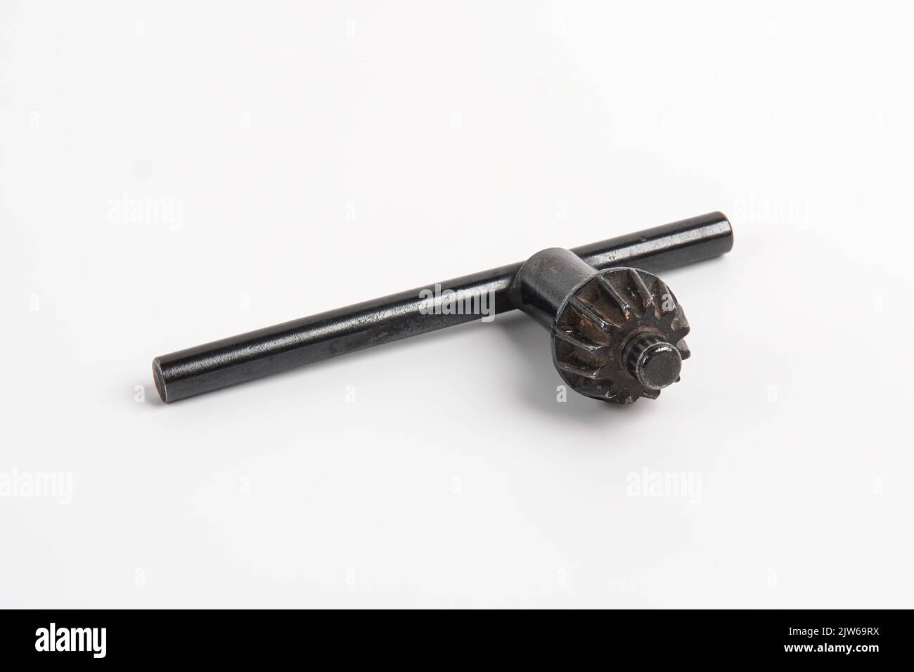A drill chuck key isolated on white background Stock Photo Alamy