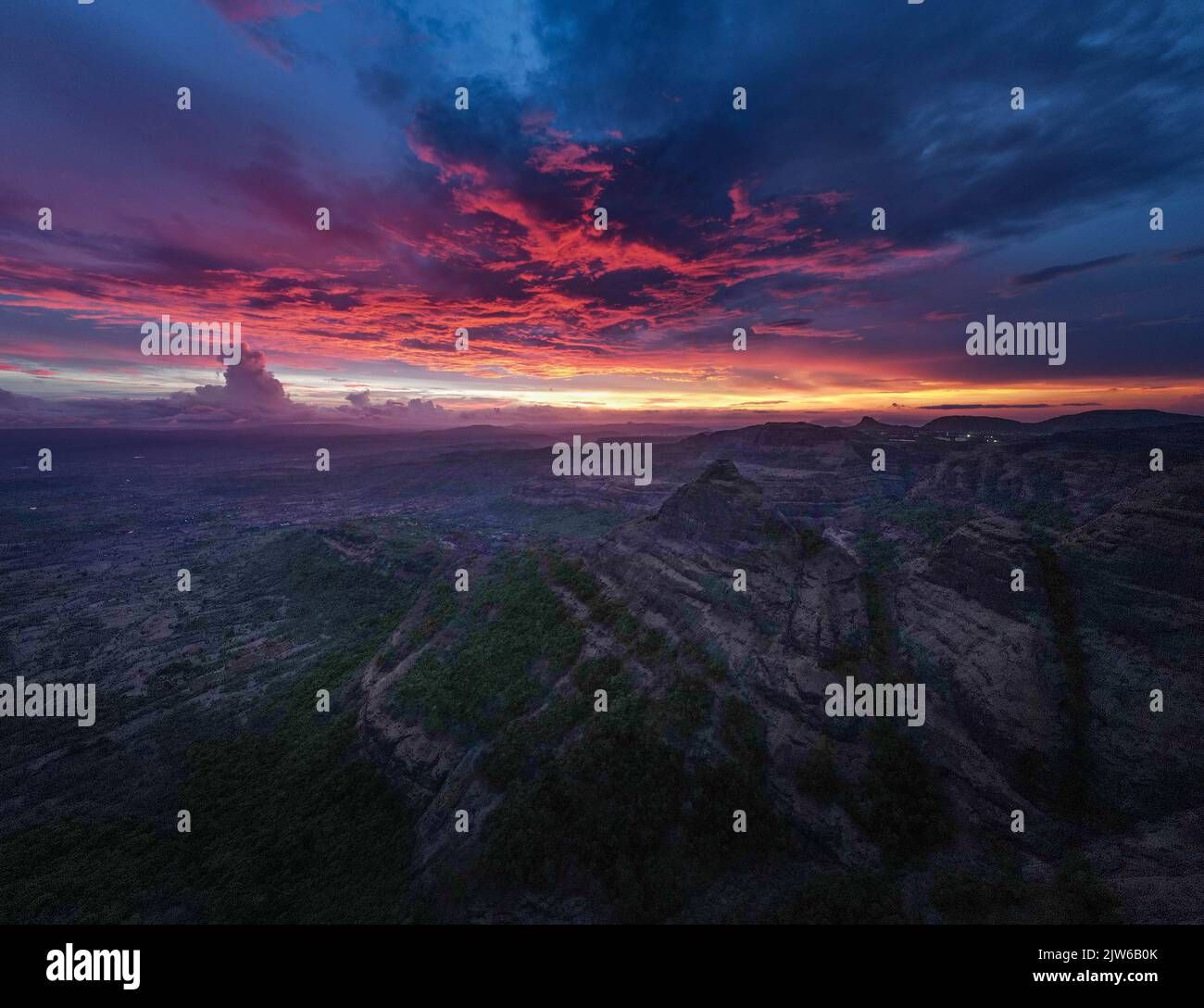 An aerial drone shot of mountainscape at sunset Stock Photo