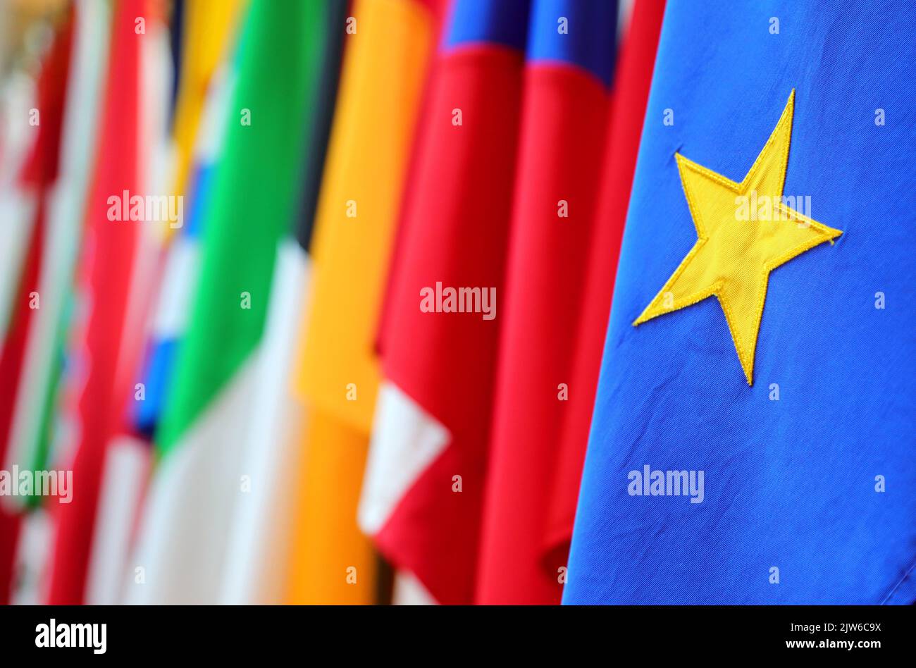yellow star on a blue background of the flag of the European Union and ...