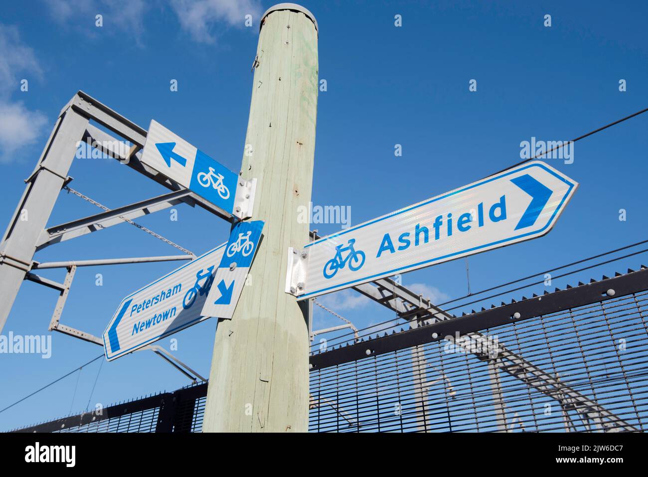 Multiple bike or bicycle path signs near Summer Hill railway station pointing to Ashfield, Newtown and Petersham in Sydney, Australia Stock Photo