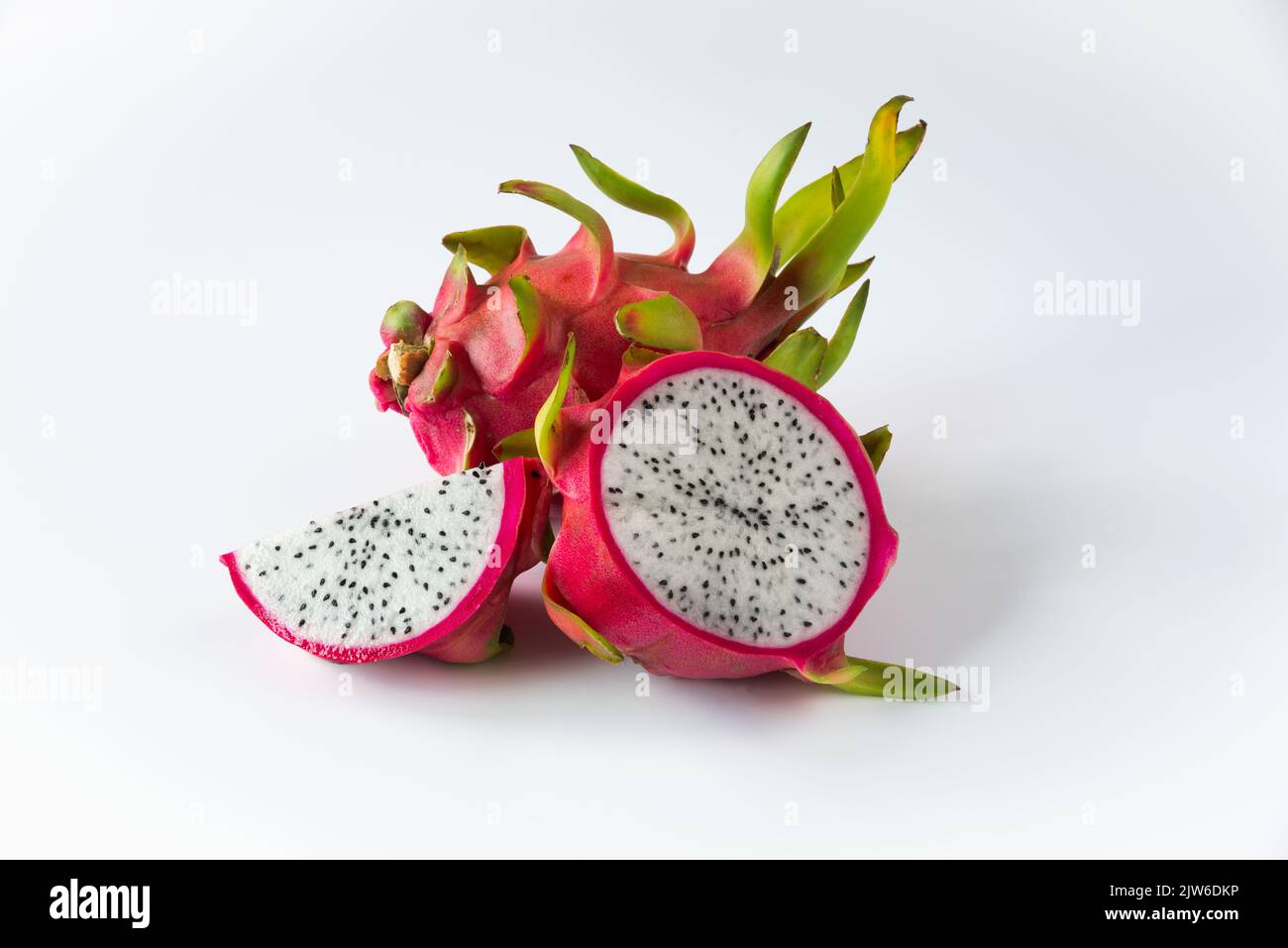 Fresh and sliced dragon fruit on white background. Stock Photo