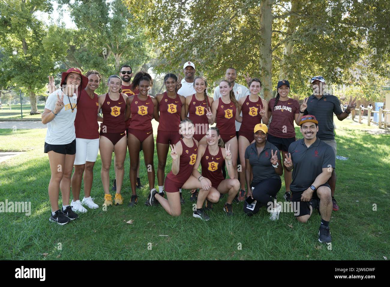 Members of the Southern California Trojans women's team including Gigi Maccagnini,  Mihajla Milovanovic,  Isabelle Cairns, Liyat Kebbede, Lucy WSashington, Janiah Brown, Giovanna Pisano, Ashlee Gallegos and Brooke Rodl and coaches Joanna Hayes, Quincy Watts, Tyree Price, Spencer Moore and director of operations Nate Collins pose during the Mark Covert Cross Country Invitational, Saturday, Sept. 3, 2022, in Brea, Calif. Stock Photo