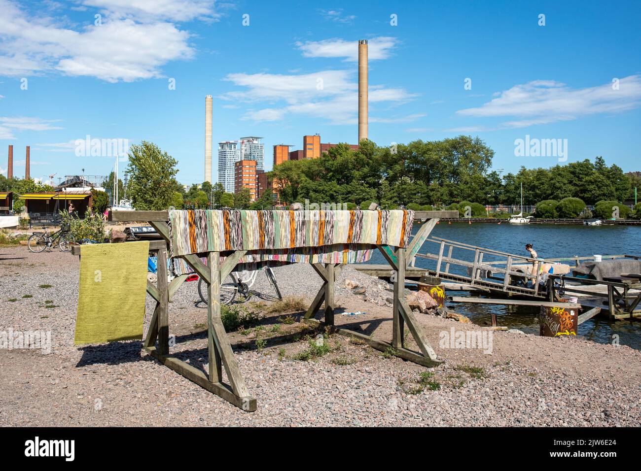 Washed carpets hanging on a drying rack by carpet washing pier in Helsinki, Finland Stock Photo