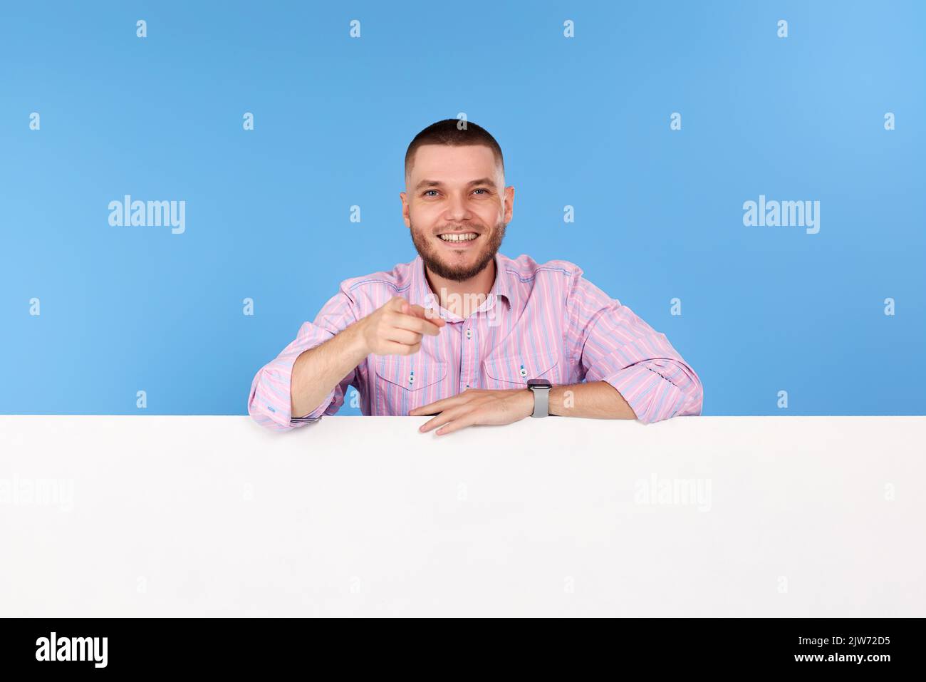 cheerful man holding board with empty copy space Stock Photo