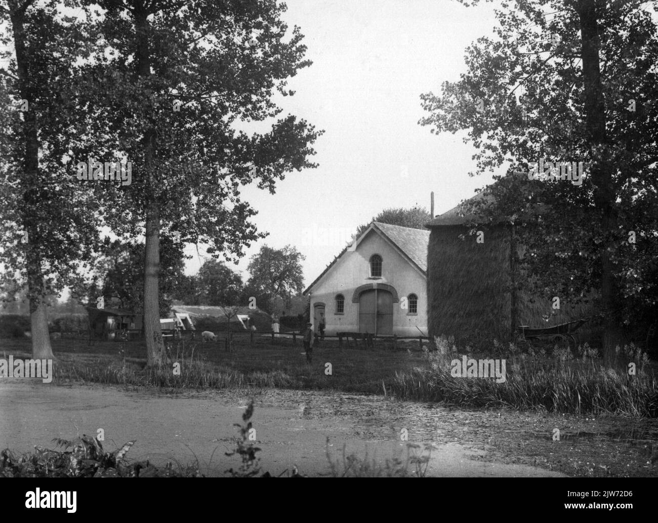 View of the farm well Ten Rijn (Rhijnauwselaan 5) in Bunnik, with the Kromme Rijn in the foreground. Stock Photo