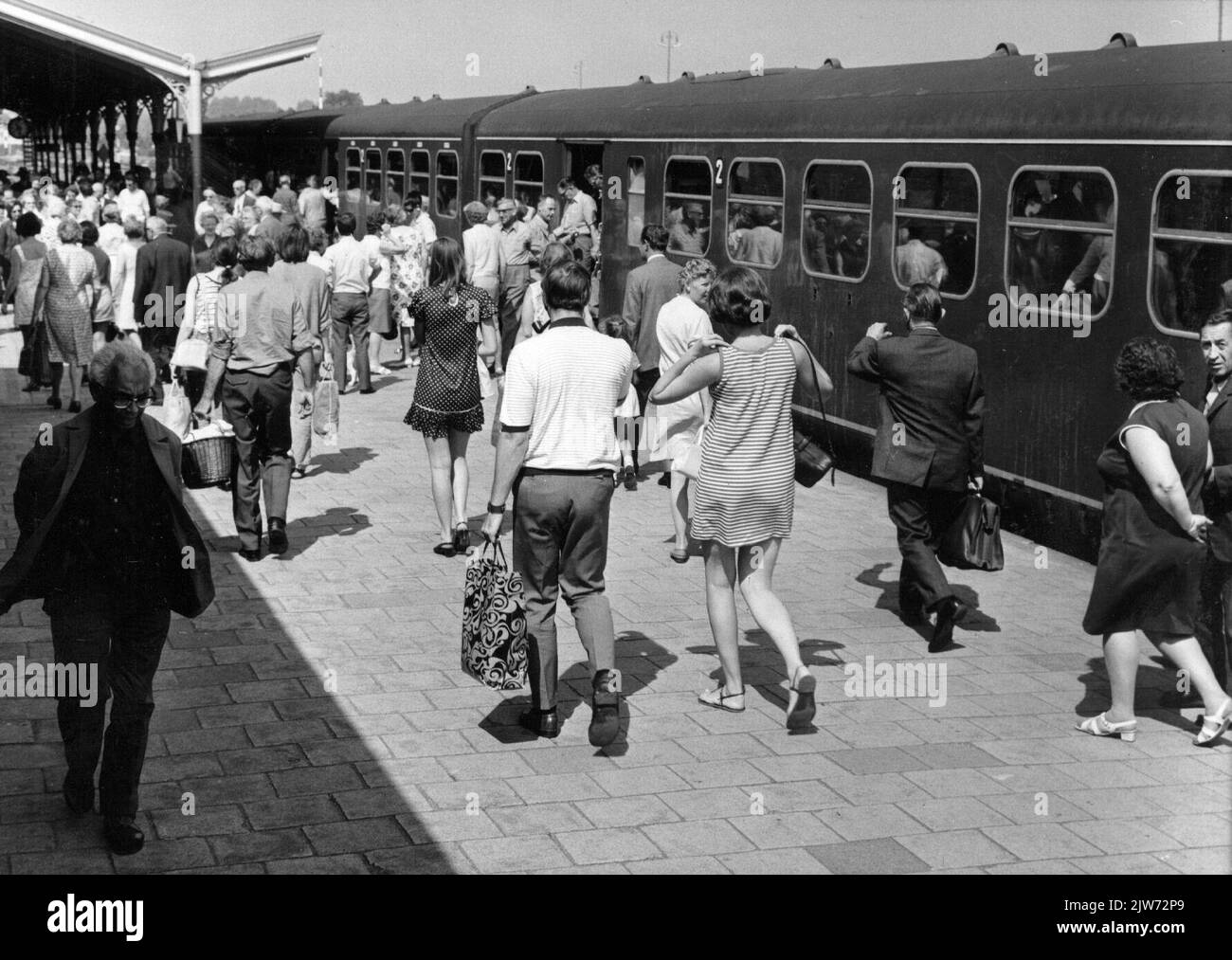 Image of train travelers during an N.S. Day trip with a market train at the N.S. station Hoorn in Hoorn. Stock Photo