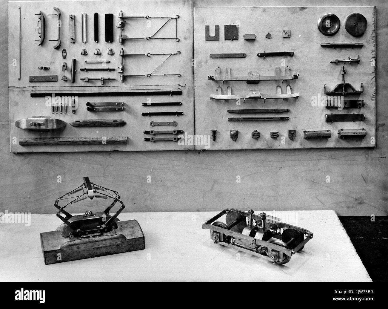 Image of various parts of a miniature model of an electric train set
