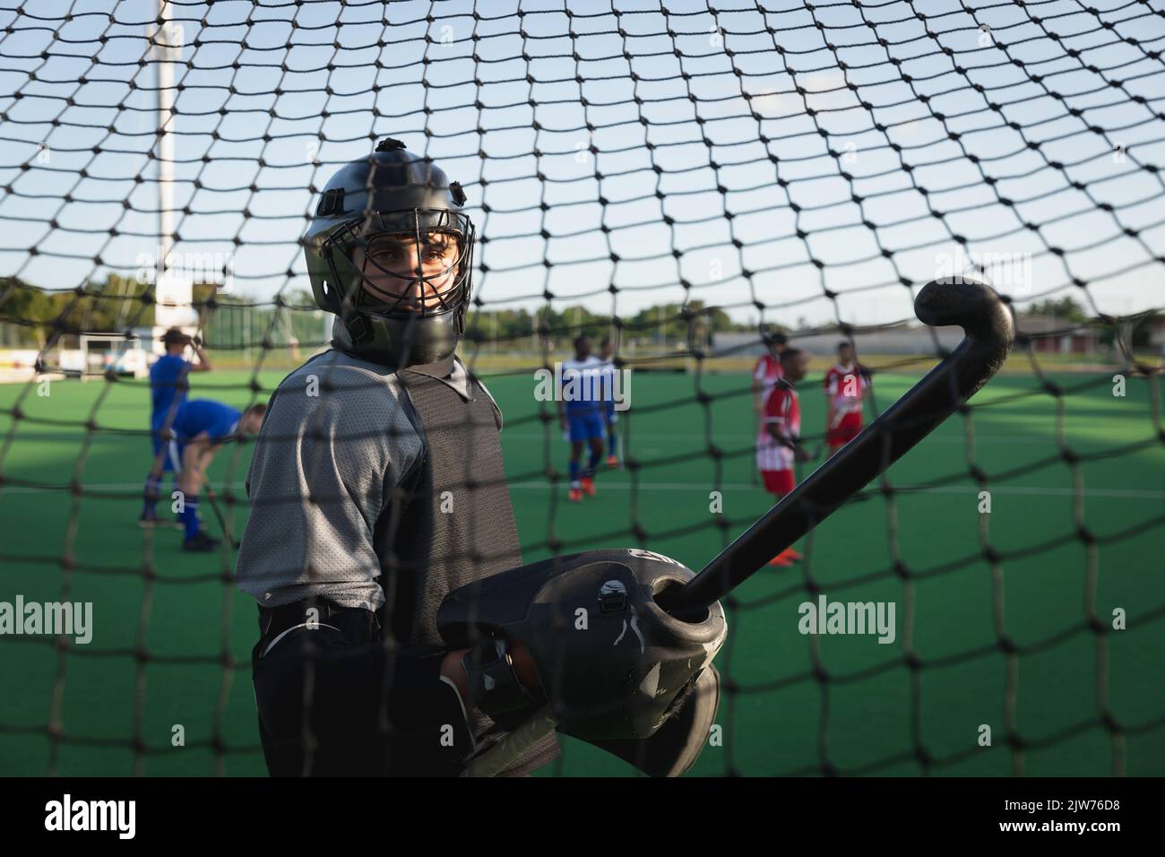 Side view of a Caucasian male field hockey goalkeeper Stock Photo