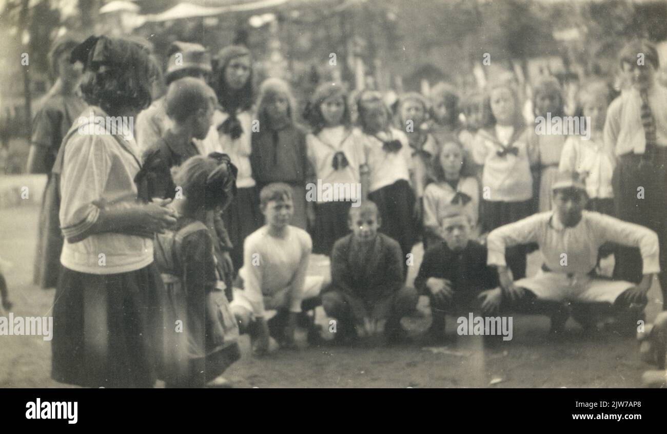 Group portrait of some members of the gymnastics association 'Excelsior' in the Oranjark in Utrecht, during the celebration of Queen's Day.n.b. The Gymnastiekvereniging was a subsection of the neighborhood association 'Oranjark' in district C. Stock Photo