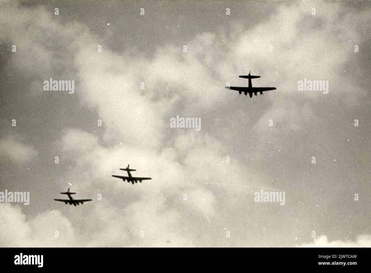 Image of some American B-17 aircraft above the city of Utrecht, on the road to throw food packages above the site at the Lageweide (Stapel site of the Dutch Railways) in Utrecht in the context of the Chowhound operation. Stock Photo