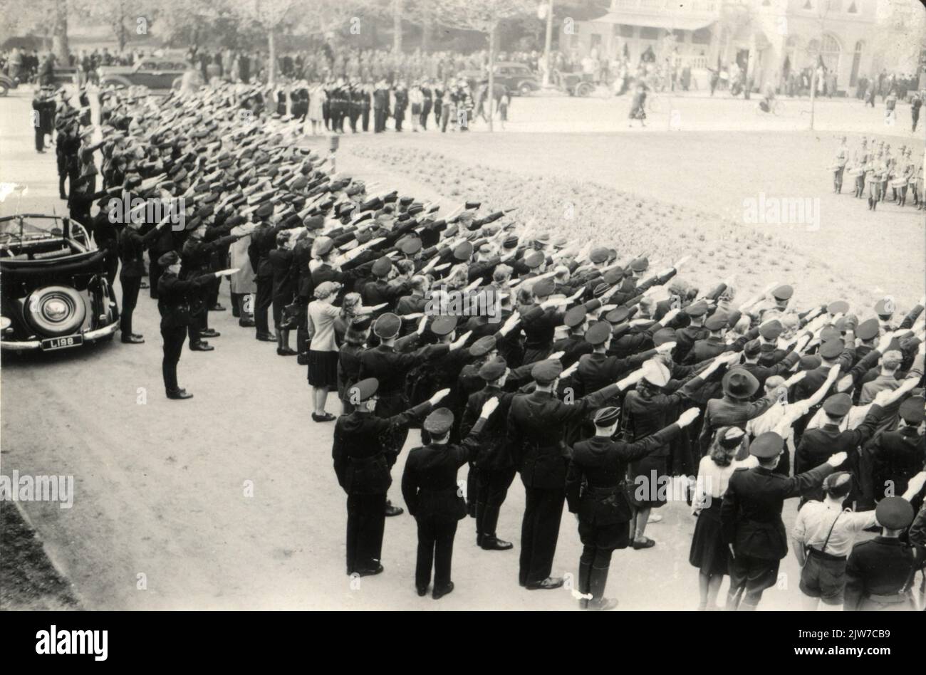 Image of members of the W.A. (Weather department) and National Youth Storm that bring the Hitlergepoet for the Stadsschouwburg in Utrecht, presumably, at the celebration of a birthday of ir. A.A. Mussert (leader of the National Socialist Movement (N.S.B.). Stock Photo