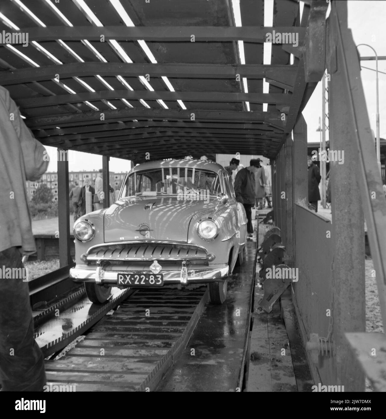 Image of parking a car on the doublecover car of a car sleeping train