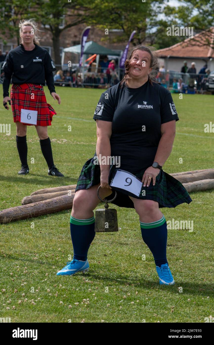 Woman's Weight over the Bar event, Highland Games, North Berwick Stock Photo