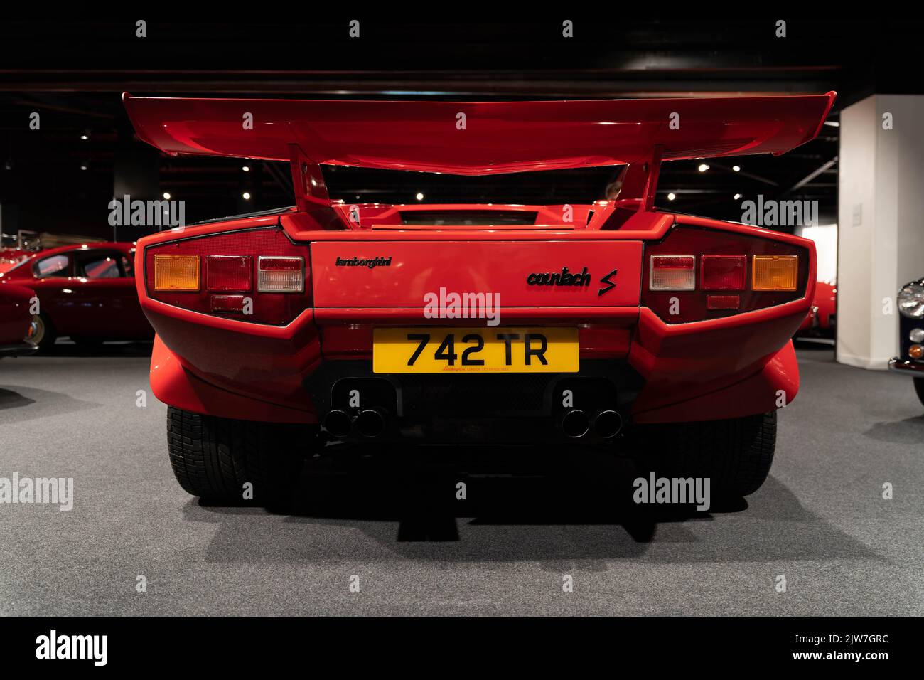 Red Lamborghini Countach S supercar rear view in showroom with spoiler ...