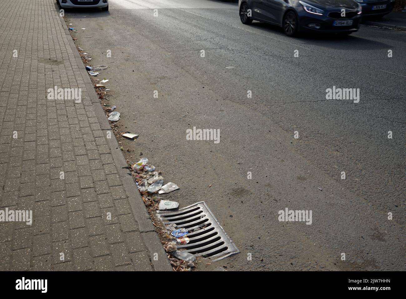 Rubbish or trash at the side of a road in London, England. An unattractive sight. An unhealthy environment. Stock Photo