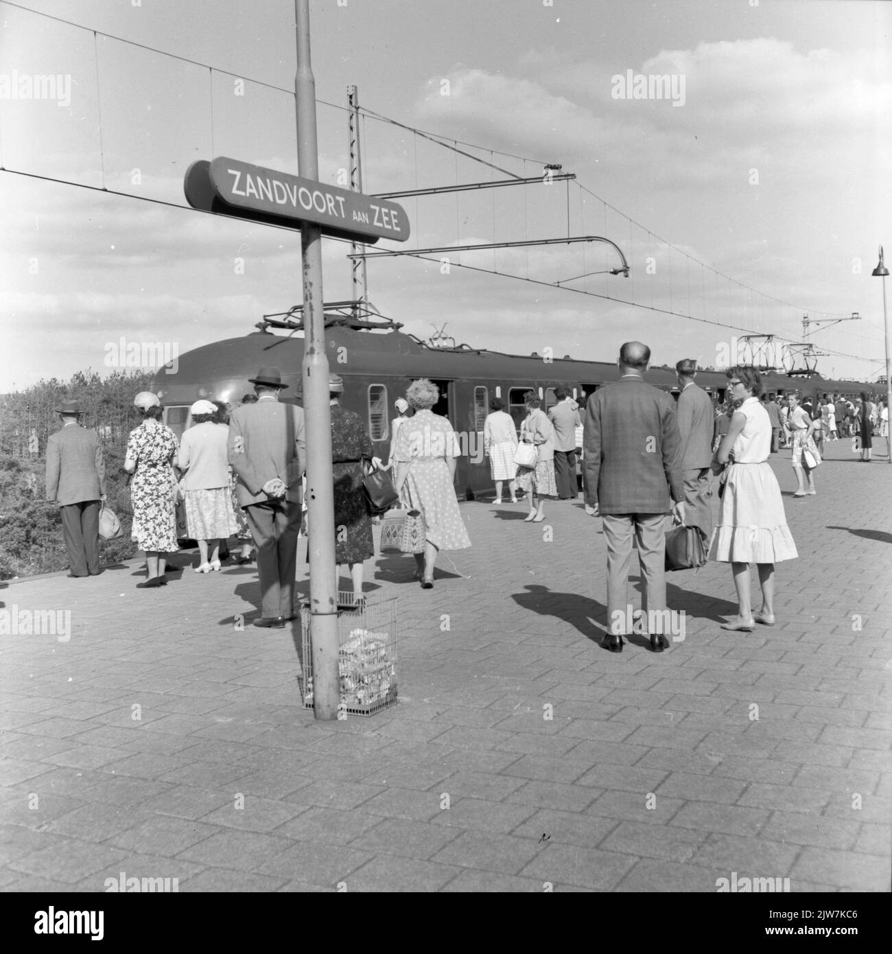 Image of beachgoers on the platform of the N.S. station Zandvoort aan Zee. Stock Photo