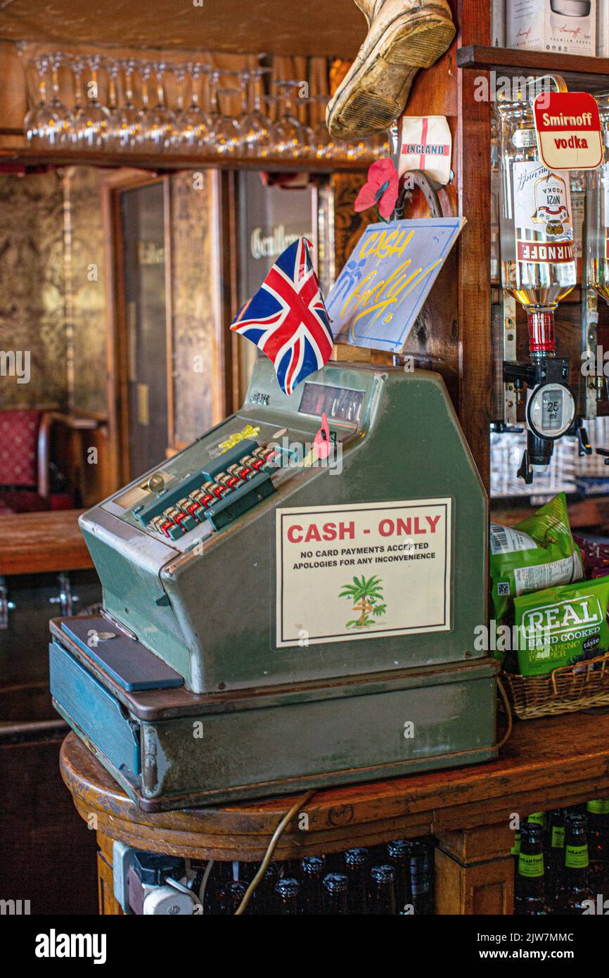 old vintage mechanical cash register with sign cash only Stock Photo