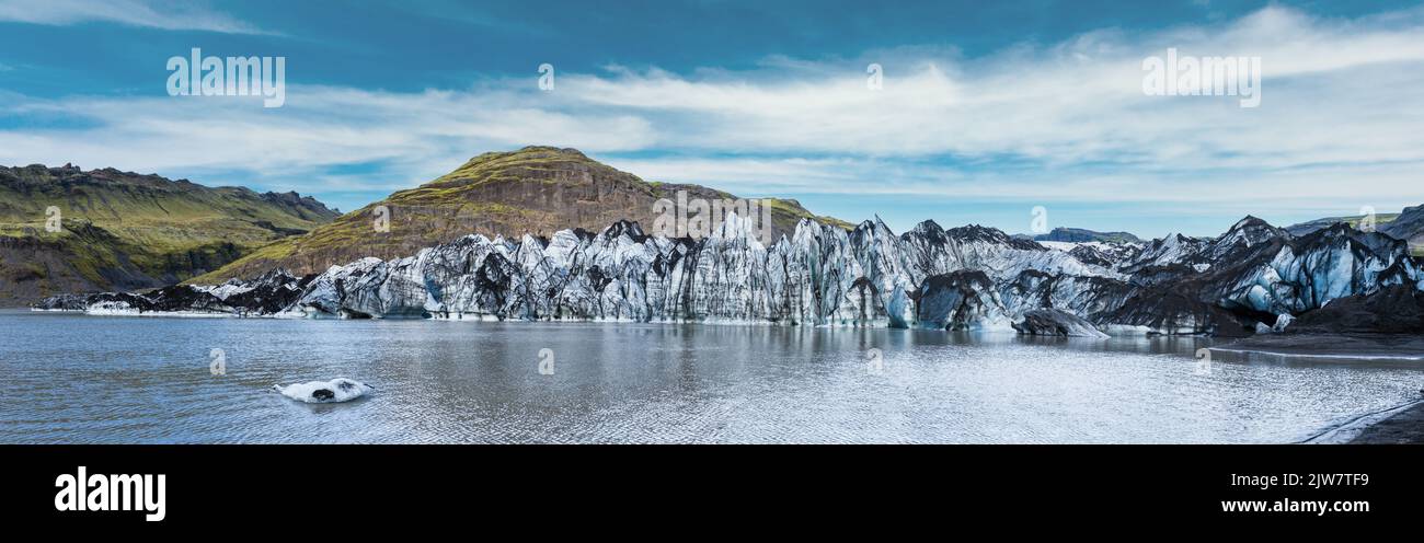 Solheimajokull glacier, Iceland. The tongue of this glacier slides from the volcano Katla. Beautiful glacial lake lagoon with blocks of ice and surrou Stock Photo