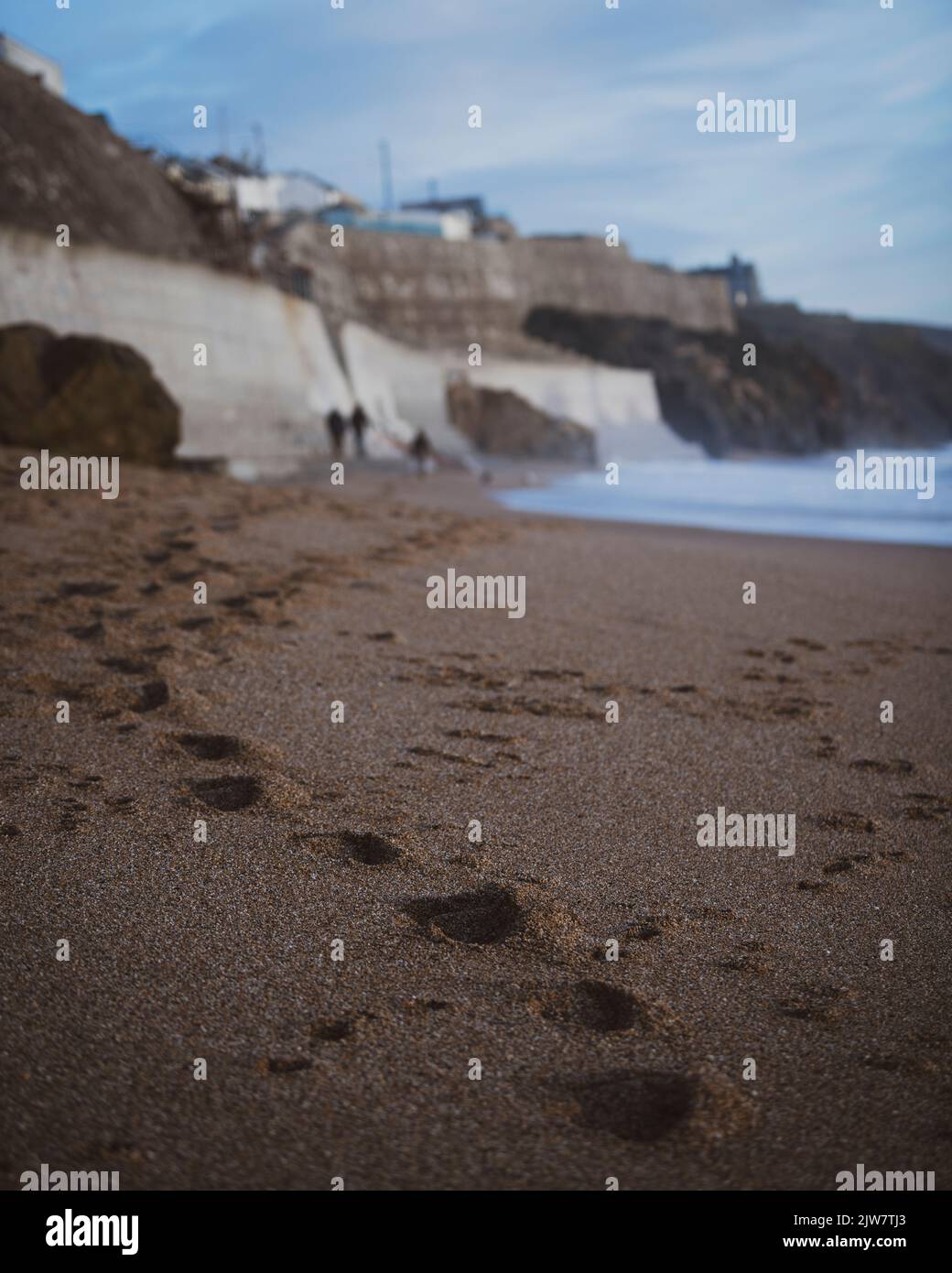 Porthleven beach awash with waves of all sizes Stock Photo Alamy
