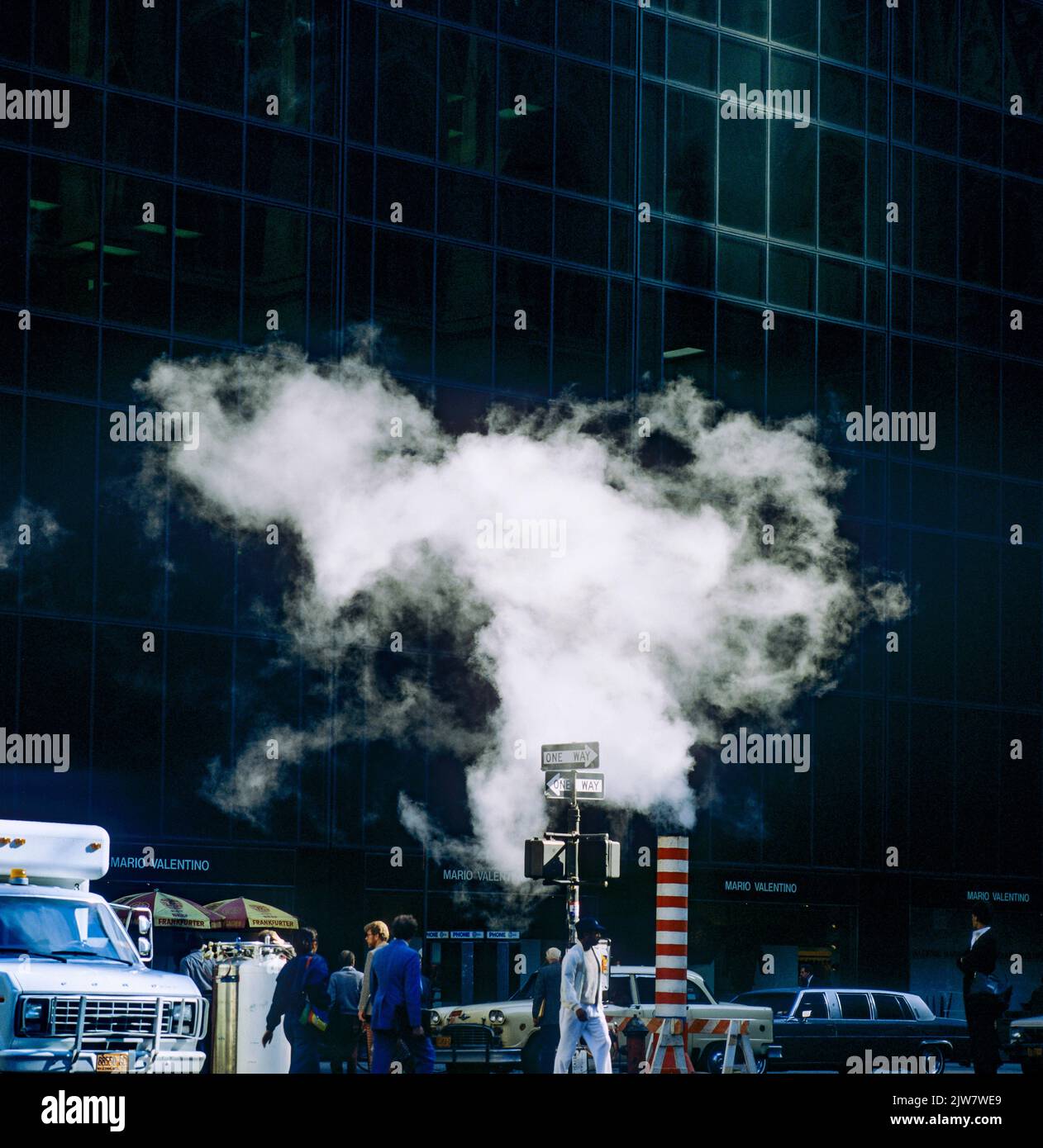 New York, 1980s, backlit vapour raising out from steam pipe vent