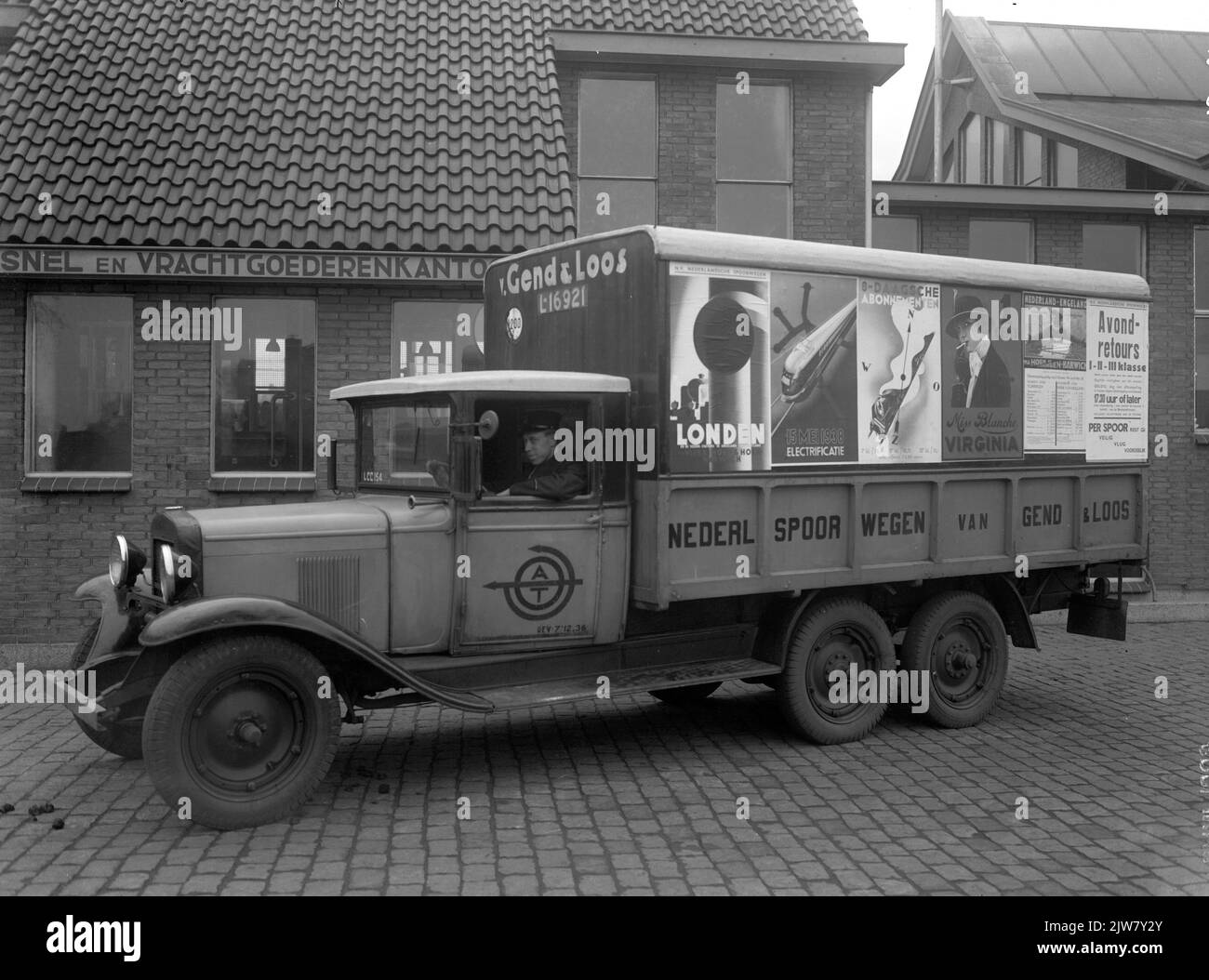 Image of a truck (wallpapering with advertising posters) of the A.T.O. / Van Gend & Loos at the cargo office on the Mineurslaan in Utrecht. Stock Photo