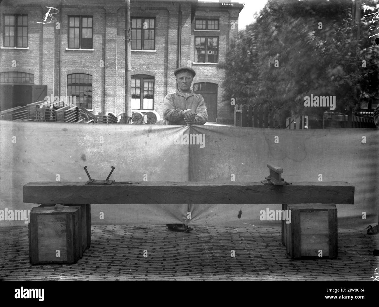 Image of the arrangement of a wooden crossbar with a piece of rail, a slope plate and some rail jabs, for a photo, on the site of the superstructure workshop of the N.S. on the 2nd Daalsedijk in Utrecht. Stock Photo