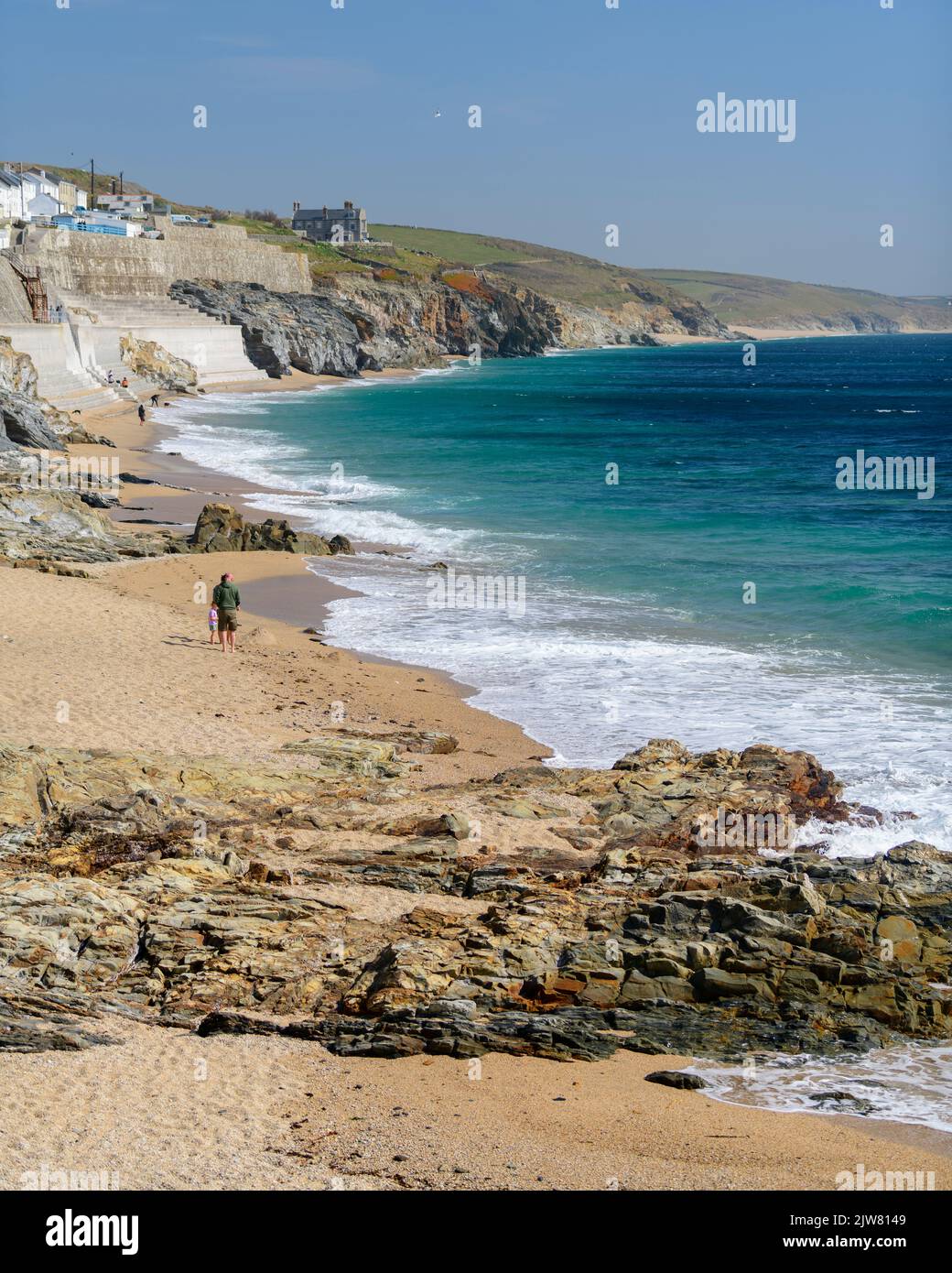 Porthleven beach awash with waves of all sizes. Stock Photo