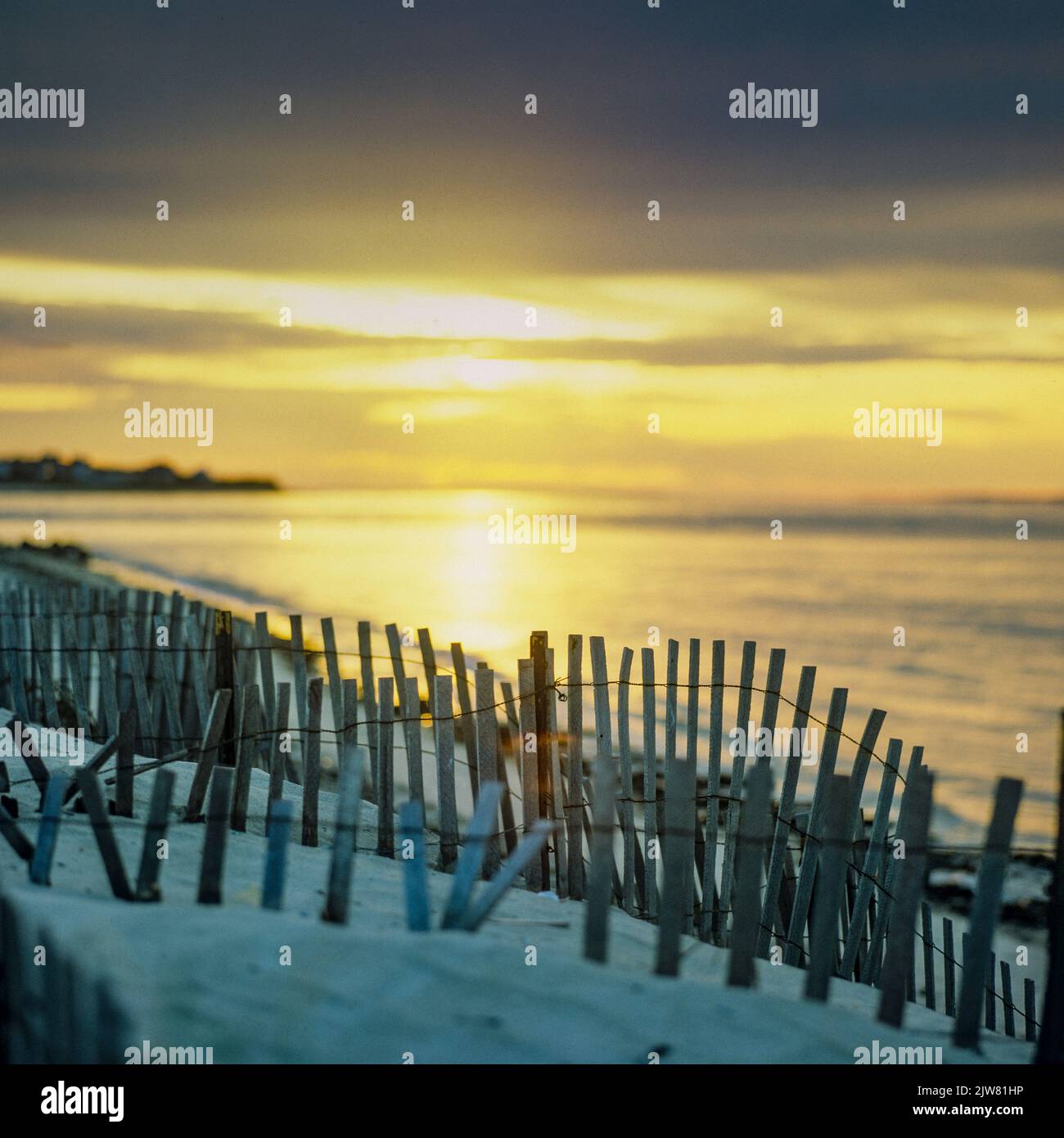New York, 1980s, beach wooden picket fences, sunset reflection on