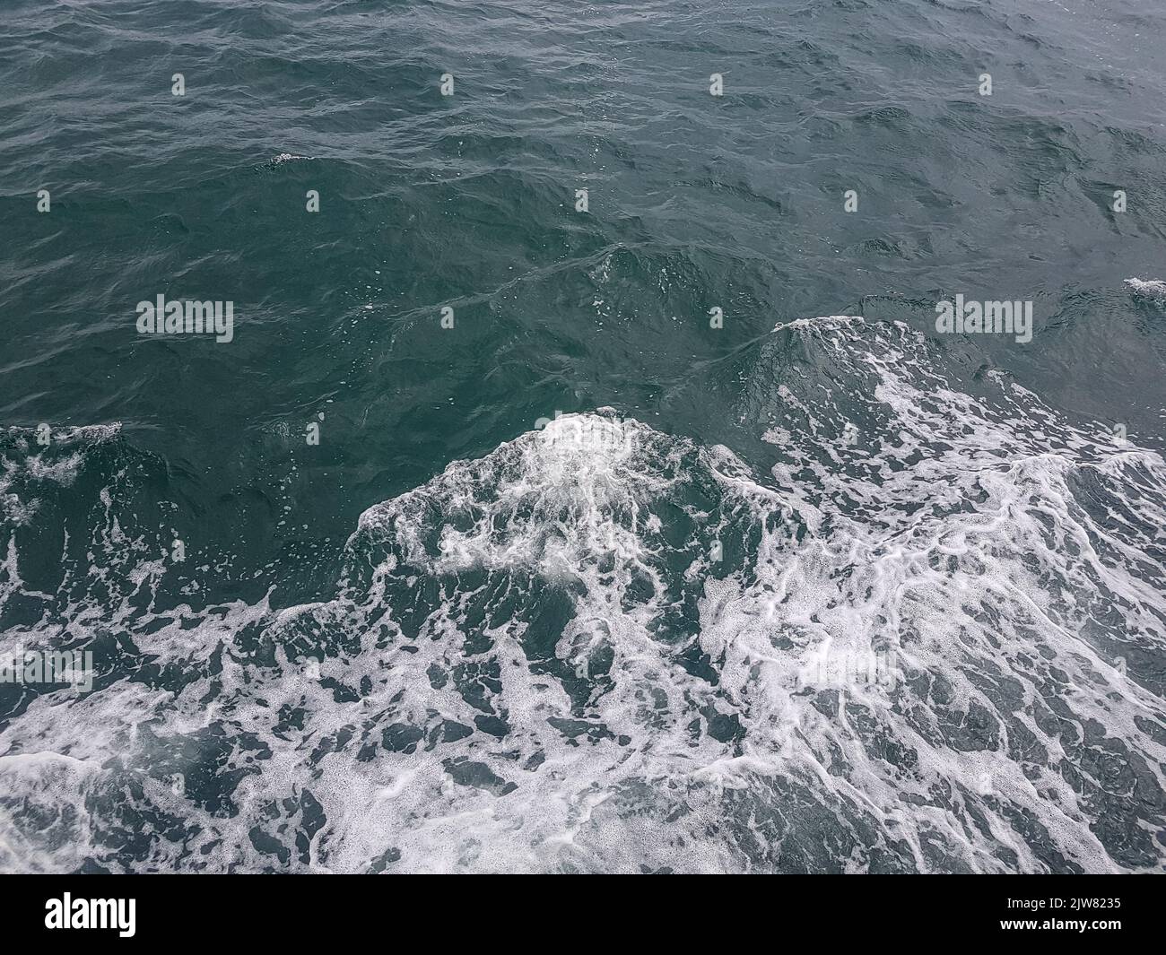 Surface of blue water Sea wave Colored background Stock Photo - Alamy