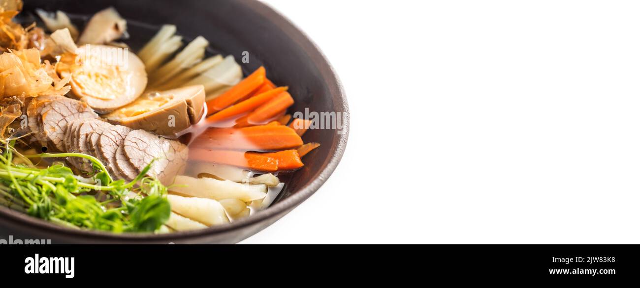Traditional Japanese soup Ramen in bowl isolated on white Stock Photo