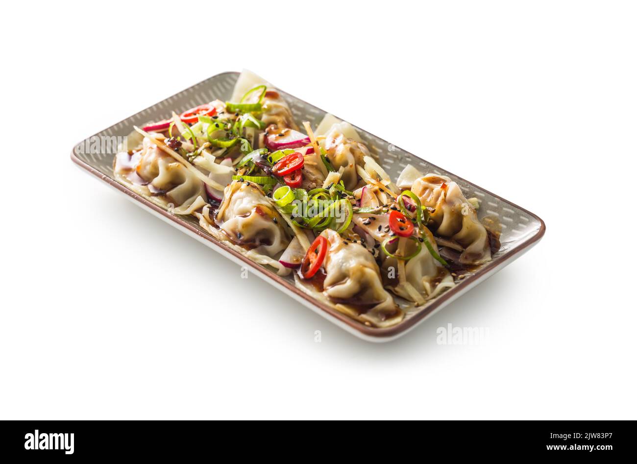 Traditional Japanese dumplings Gyoza on plate isolated on white. Stock Photo