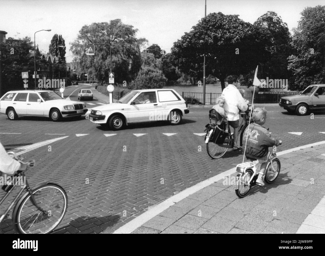 Image of the unsafe traffic situation for cyclists at the Singel intersection (foreground) - Westdam (right) - Zandwijksingel (background) in Woerden. Stock Photo