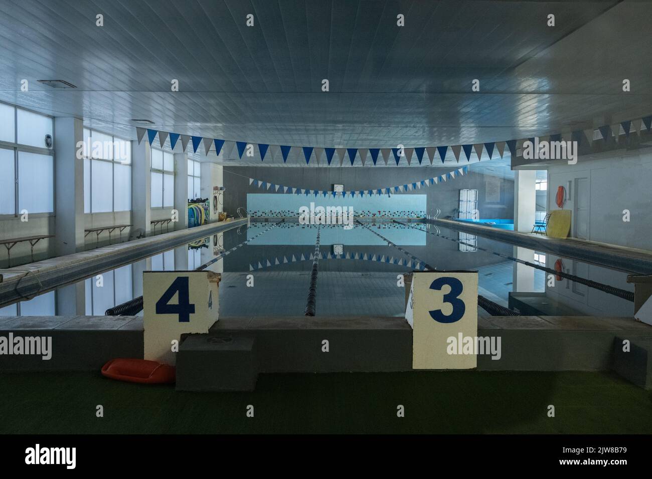 A start line of an indoors swimming pool Stock Photo - Alamy