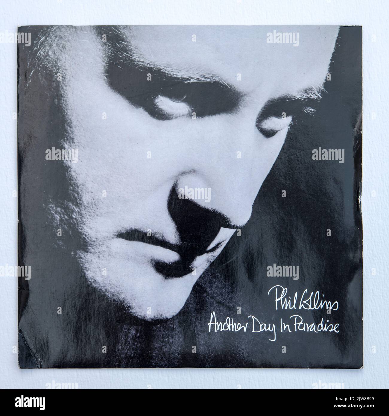 Picture cover of the seven inch single version of Another Day in Paradise by Phil Collins, which was released in 1989. Stock Photo