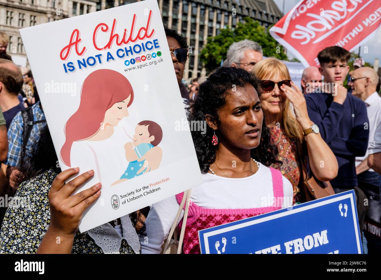 London, UK. 3 September 2022. Members of anti-abortion groups rally in Parliament Square, Westminster following an annual 'March For Life' in central London. Pro-choice abortion campaigners also gather to voice their opposition to the anti-abortion movement. Pictured: Placards displaying anti abortion messaging are held by activists during the rally. Stock Photo