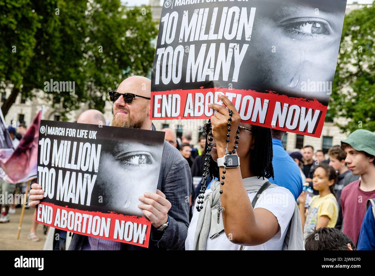 London, UK. 3 September 2022. Members of anti-abortion groups rally in Parliament Square, Westminster following an annual 'March For Life' in central London. Pro-choice abortion campaigners also gather to voice their opposition to the anti-abortion movement. Pictured: Placards displaying anti abortion messaging are held by activists during the rally. Stock Photo