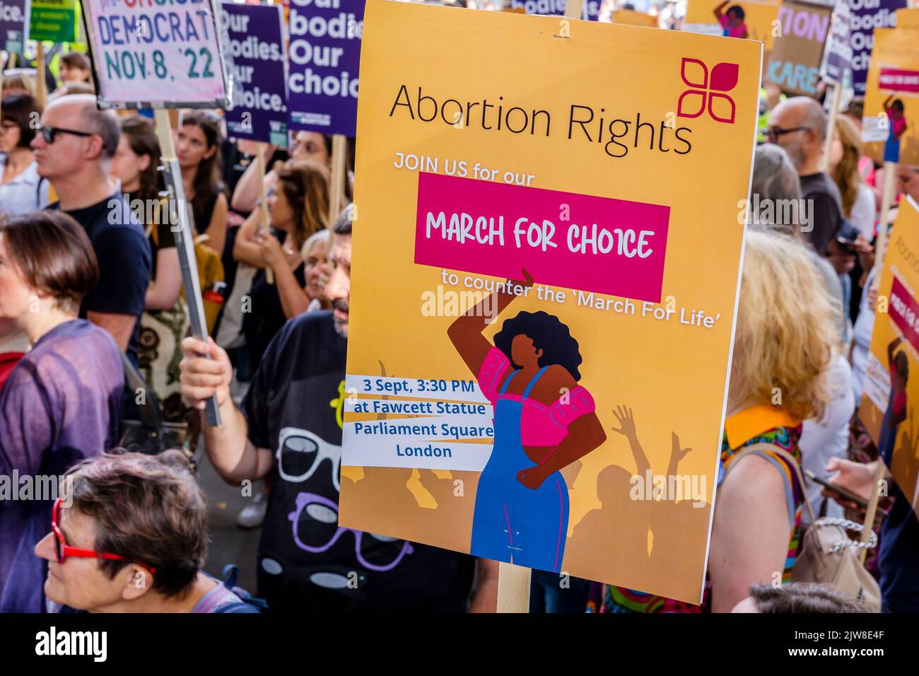 London, UK. 3 September 2022.  Pro-choice abortion campaigners display messaging of women's rights to choose during a March for Choice rally in Parliament Square in opposition to a rally also being held by anti-abortion campaign groups. Stock Photo