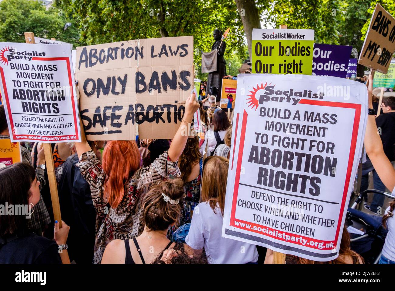 London, UK. 3 September 2022.  Pro-choice abortion campaigners display messaging of women's rights to choose during a March for Choice rally in Parliament Square in opposition to a rally also being held by anti-abortion campaign groups. Stock Photo