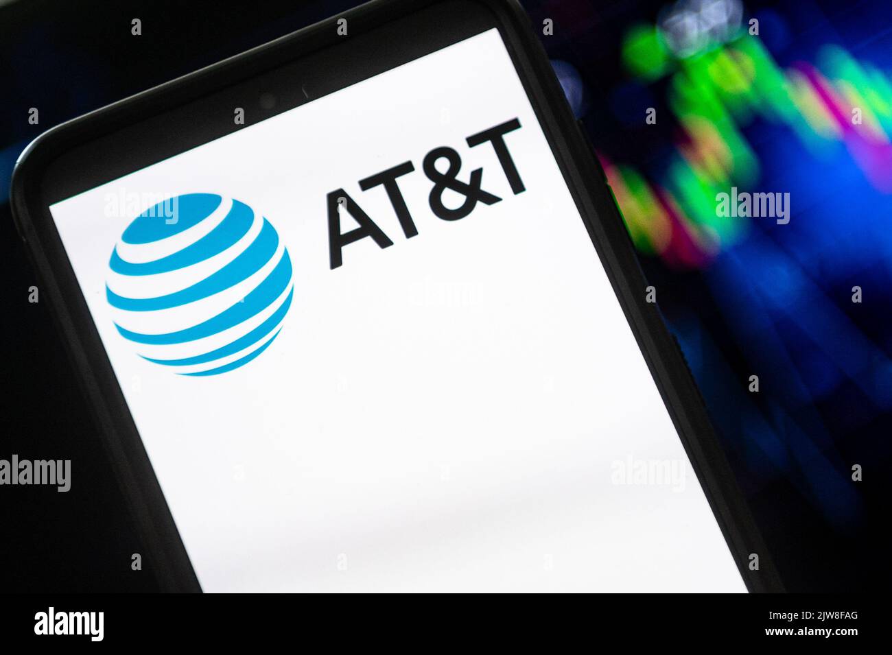 In this photo illustration a AT&T logo seen displayed on a smartphone ...