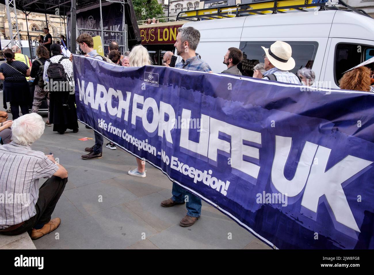 London, UK. 3 September 2022. Members of anti-abortion groups rally in Parliament Square, Westminster following an annual 'March For Life' in central London. Pro choice abortion campaigners also gather to voice their opposition to the anti-abortion movement. Pictured: Campaigners hold March For Life UK banner at rally in London. Stock Photo