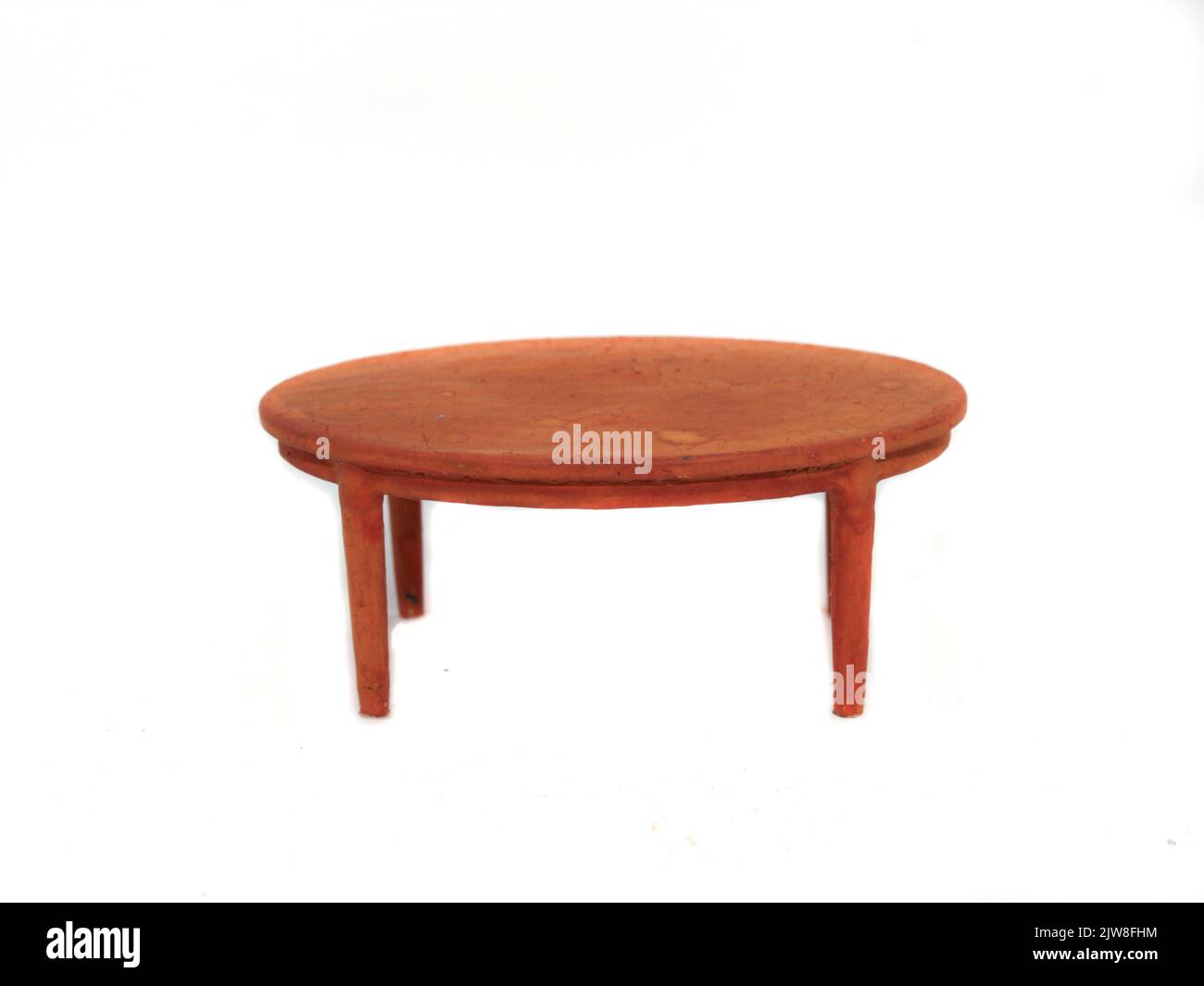 A light brown round table isolated on a white background Stock Photo Alamy