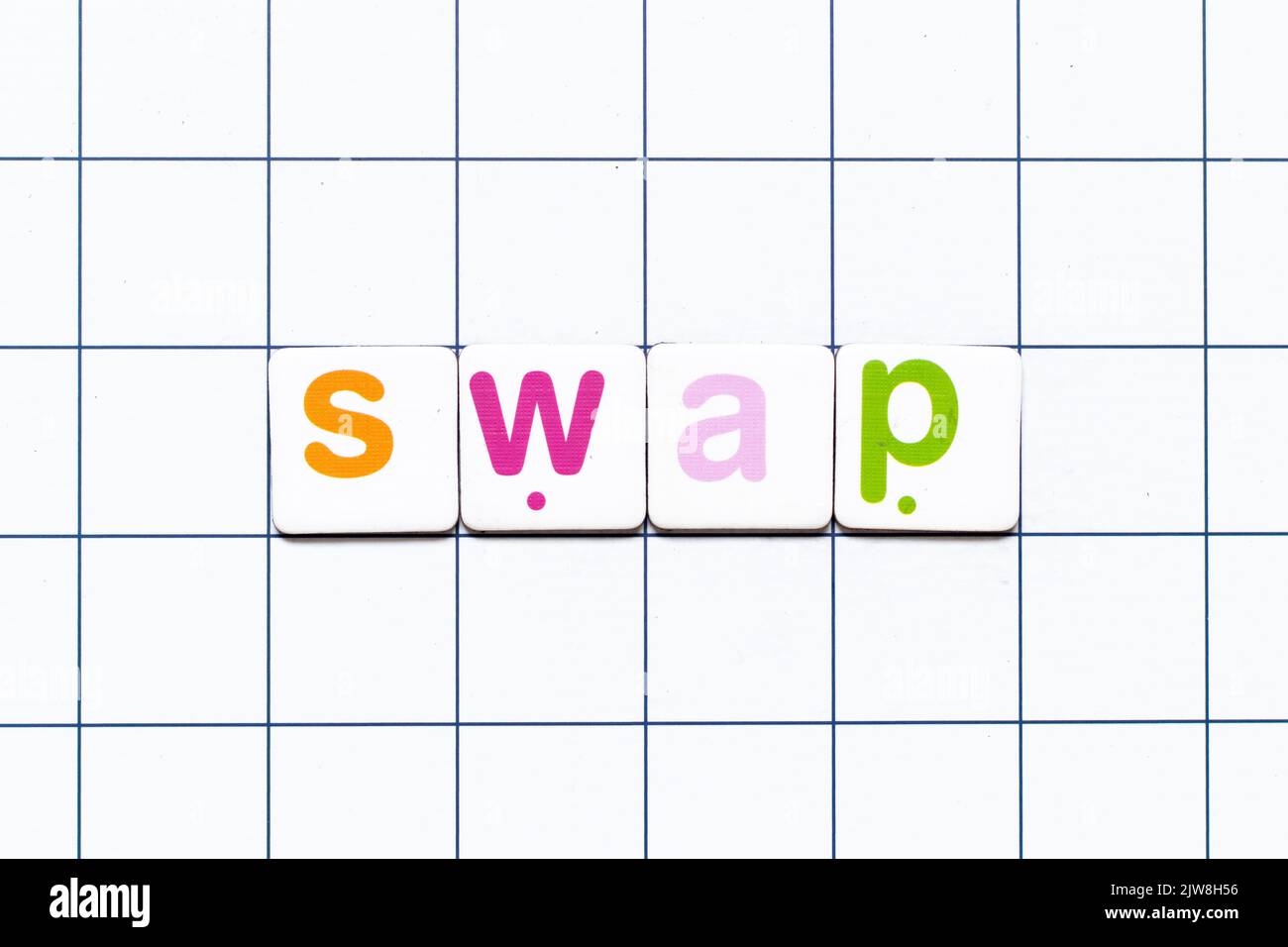 Colorful tile letter in word swap on white grid background Stock Photo