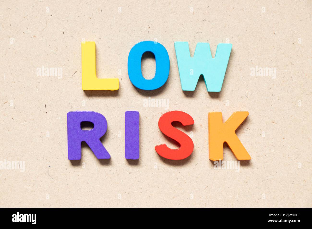 Color alphabet letter in word low risk on wood background Stock Photo ...