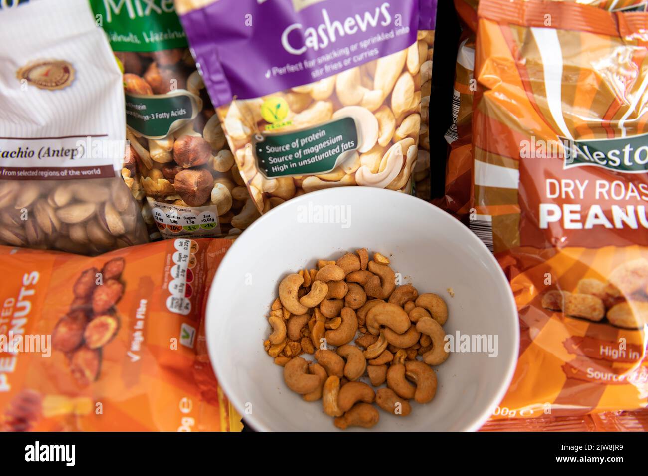 London. UK- 09.01.2022. A variety of nuts in packages. Stock Photo
