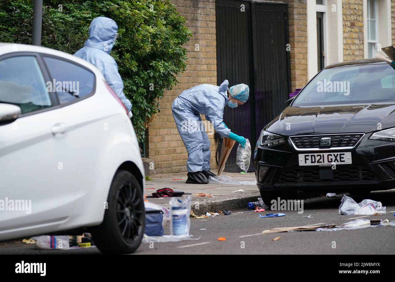 Forensic officers in Lichfield Road, east London, following a teenager