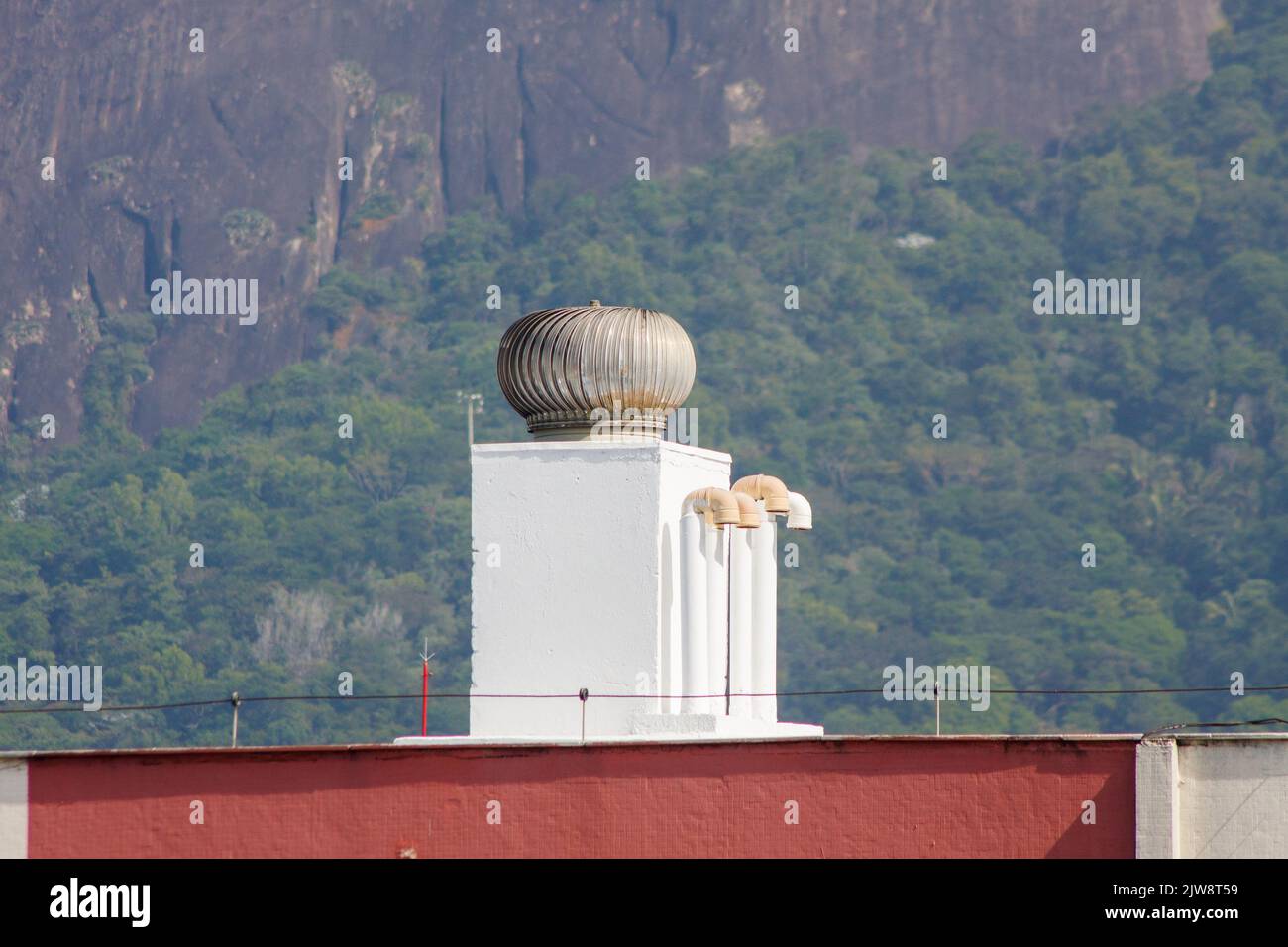 wind turbine on top of a building in Rio de Janeiro. Stock Photo